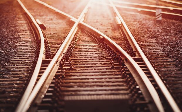 View of the crossing railway in sunset in summer.