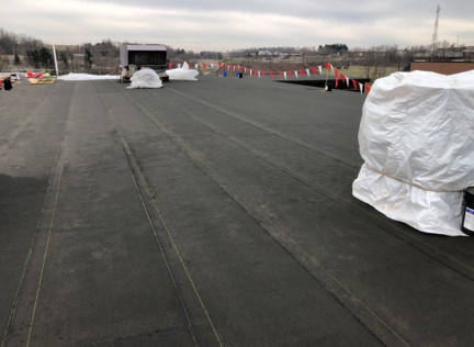 Photo of StressBase 80 being installed on roof