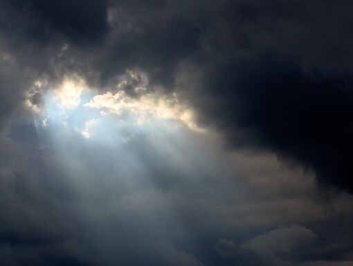Sun beam in Dark Clouds and Sky before Thunderstorm