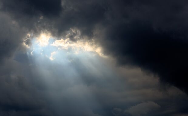 Sun beam in Dark Clouds and Sky before Thunderstorm