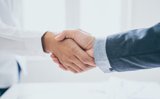 Teamwork,partnership and Social connection in business join hand together,Finishing up a meeting,handshake of happy business people after contract agreement to become a partner,collaborative teamwork.