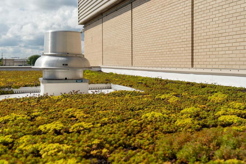 Photos of the Niles North High School Skokie, IL Chicago by Justin Reed & Matt Lemere

Base Sheet: StressBase 80 Plus
Cap Sheet: StressPly E FR Mineral
Surface Coating: GarlaBrite

Metal roof over the gym, featuring a small section of green roof