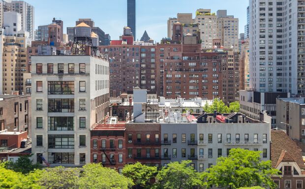 New York City - Overhead view of historic buildings along 59th Street with the Midtown Manhattan skyline in the background